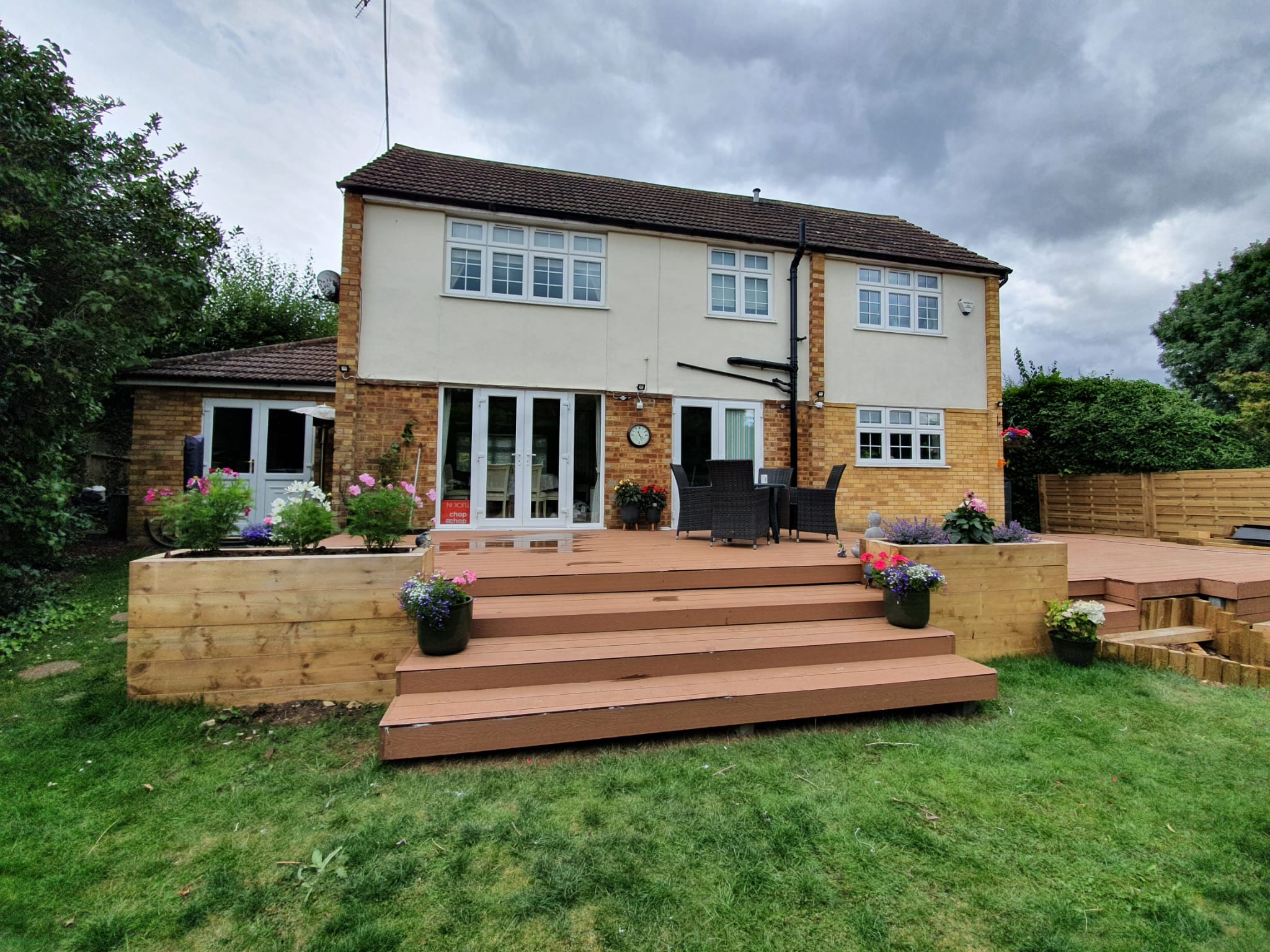 Seating area and Raised beds with wooden sleepers